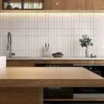 Modern kitchen with wooden island white tiled backsplash stainless steel faucet and built in oven