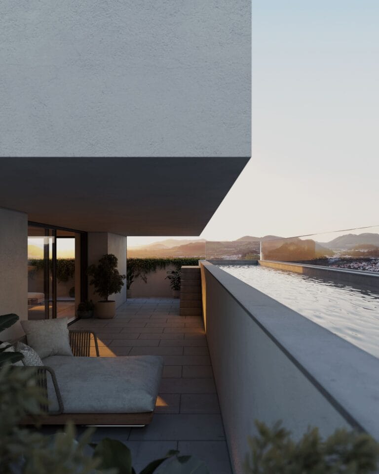 Modern outdoor balcony with a built in pool seating area and distant mountains at sunset