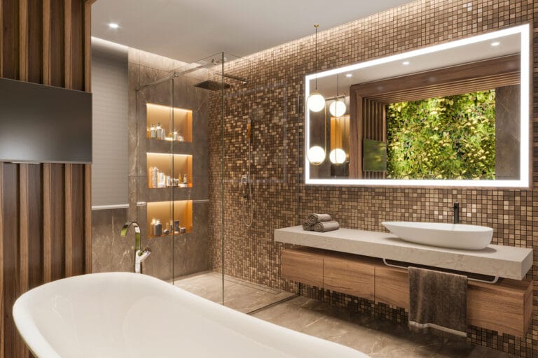 Luxurious modern bathroom with mosaic tile walls glass shower freestanding tub and a green plant wall