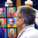 Pop art collage of elderly man portraits in bright colors on a dark panel with people walking by